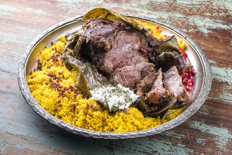 slow-cooked-omani-lamb-shuwa-coated-rub-spices-wrapped-banana-leaves-rice-yoghurt-slow-cooked-omani-lamb-243094649